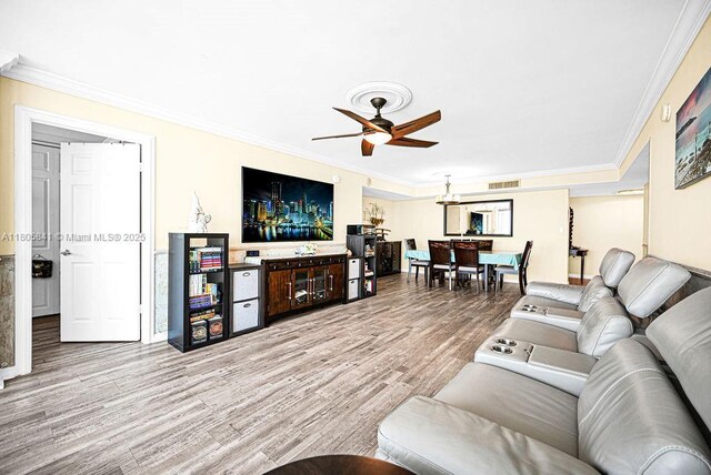 2655 Collins Ave Unit 1501, Miami Beach, FL 33140 - living room featuring crown molding, a ceiling fan, and wood finished floors
