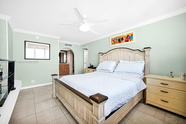 2655 Collins Ave Unit 1501, Miami Beach, FL 33140 - bedroom featuring arched walkways, ornamental molding, light tile patterned flooring, a ceiling fan, and baseboards