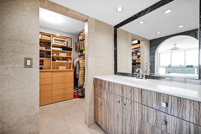 2655 Collins Ave Unit 1501, Miami Beach, FL 33140 - bar area with a sink, a ceiling fan, recessed lighting, and light tile patterned floors