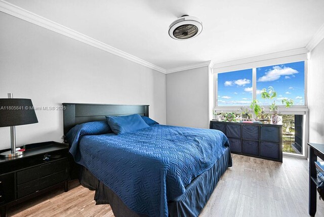2655 Collins Ave Unit 1501, Miami Beach, FL 33140 - bedroom featuring crown molding and light wood-type flooring