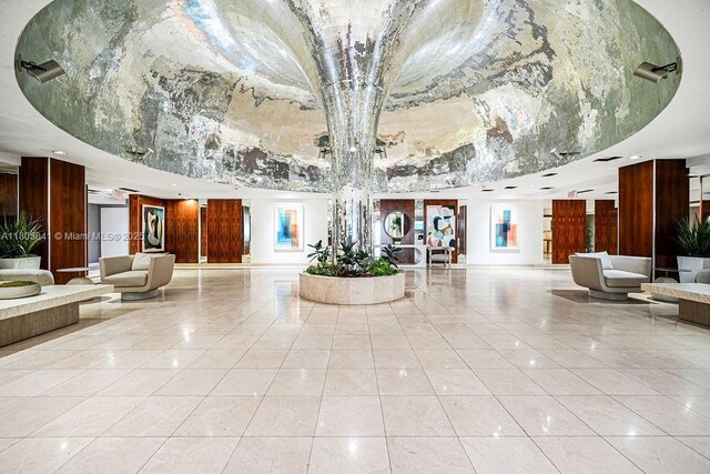 2655 Collins Ave Unit 1501, Miami Beach, FL 33140 - lobby featuring a towering ceiling and recessed lighting