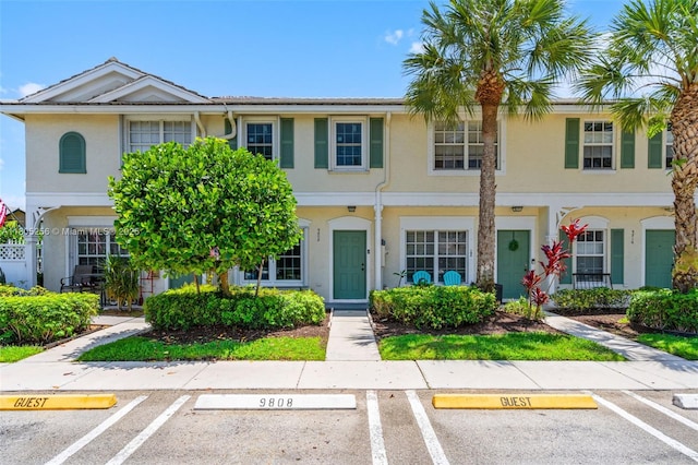 9808 NW 56th Pl, Coral Springs, FL 33076 - multi unit property with uncovered parking and stucco siding