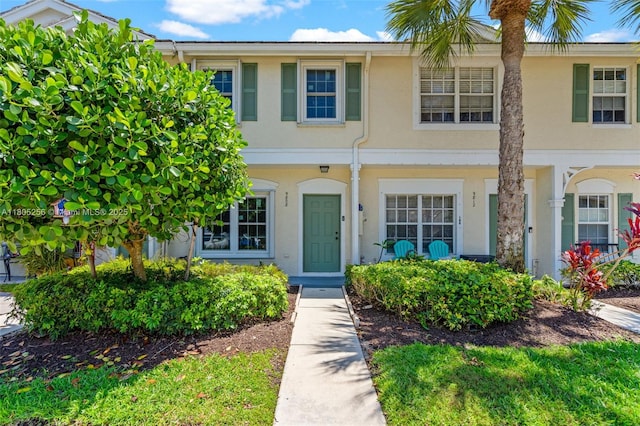 9808 NW 56th Pl, Coral Springs, FL 33076 - view of property featuring stucco siding and a chimney