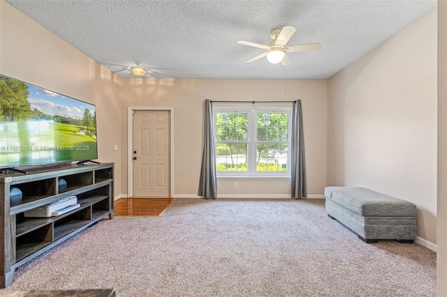 9808 NW 56th Pl, Coral Springs, FL 33076 - living area featuring carpet flooring, ceiling fan, a textured ceiling, and baseboards