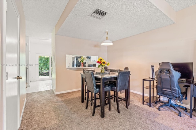 9808 NW 56th Pl, Coral Springs, FL 33076 - carpeted dining area featuring a textured ceiling and baseboards