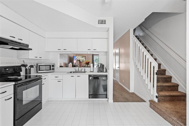 9808 NW 56th Pl, Coral Springs, FL 33076 - kitchen with black appliances, under cabinet range hood, a sink, and light countertops