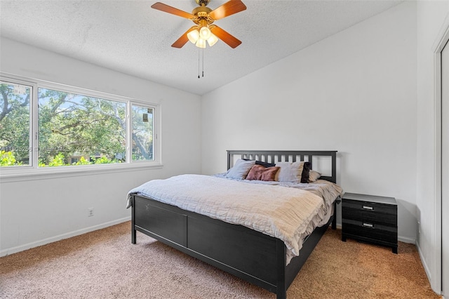 9808 NW 56th Pl, Coral Springs, FL 33076 - bedroom with light carpet, a textured ceiling, baseboards, and ceiling fan