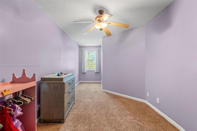 9808 NW 56th Pl, Coral Springs, FL 33076 - bedroom featuring a textured ceiling, light colored carpet, baseboards, and a ceiling fan