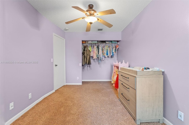 9808 NW 56th Pl, Coral Springs, FL 33076 - bedroom with light carpet, a textured ceiling, baseboards, and ceiling fan