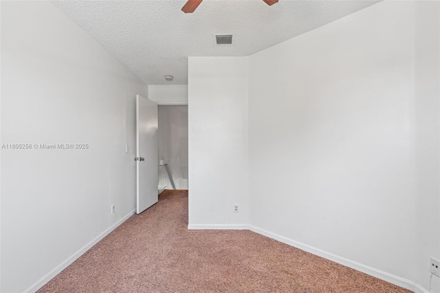9808 NW 56th Pl, Coral Springs, FL 33076 - carpeted spare room with a textured ceiling, ceiling fan, and baseboards