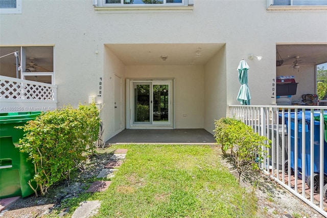 9808 NW 56th Pl, Coral Springs, FL 33076 - doorway to property with stucco siding, a ceiling fan, and a patio