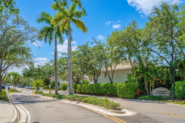 9808 NW 56th Pl, Coral Springs, FL 33076 - view of asphalt street featuring curbs and street lighting