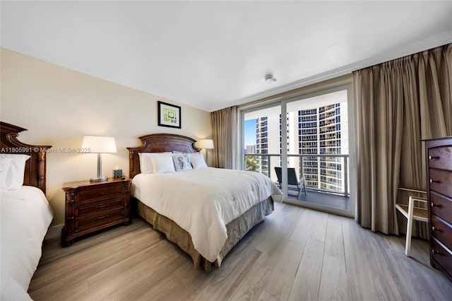 19201 Collins Ave Unit 721, Sunny Isles Beach, FL 33160 - bedroom featuring light wood-style flooring and floor to ceiling windows