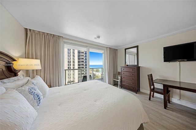 19201 Collins Ave Unit 721, Sunny Isles Beach, FL 33160 - bedroom with crown molding, wood finished floors, and baseboards