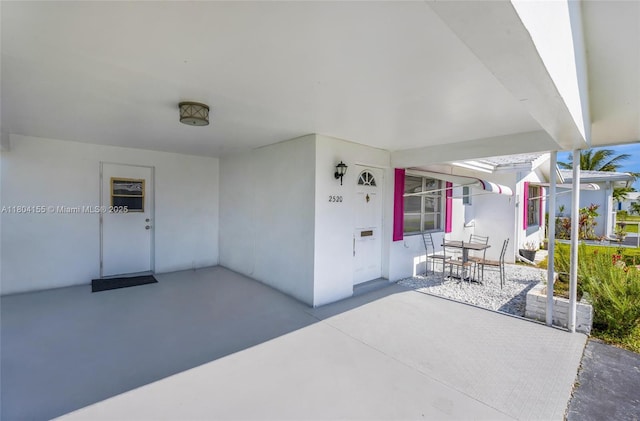 view of patio / terrace with a carport