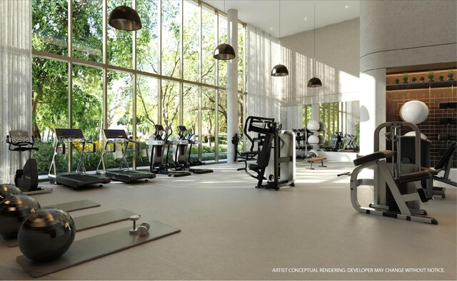 2200 Brickell Ave Unit 207, Miami, FL 33129 - workout area with a high ceiling and floor to ceiling windows