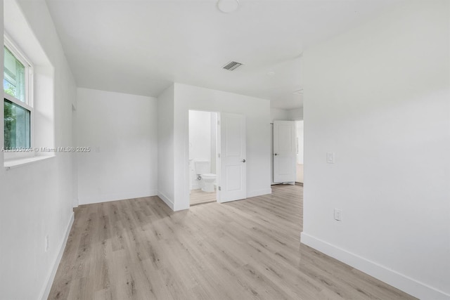 3973 4th Ave SE, Naples, FL 34117 - spare room featuring baseboards and light wood-style flooring