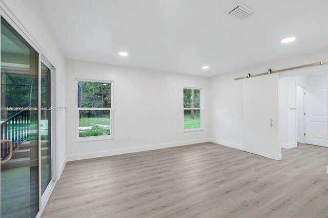 3973 4th Ave SE, Naples, FL 34117 - unfurnished room with wood finished floors, recessed lighting, and baseboards