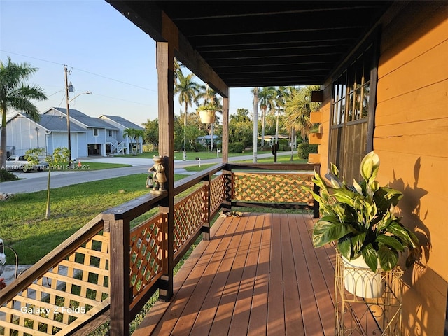 4070 E River Ft, Myers, FL 33916 - wooden terrace with covered porch, a residential view, and a lawn