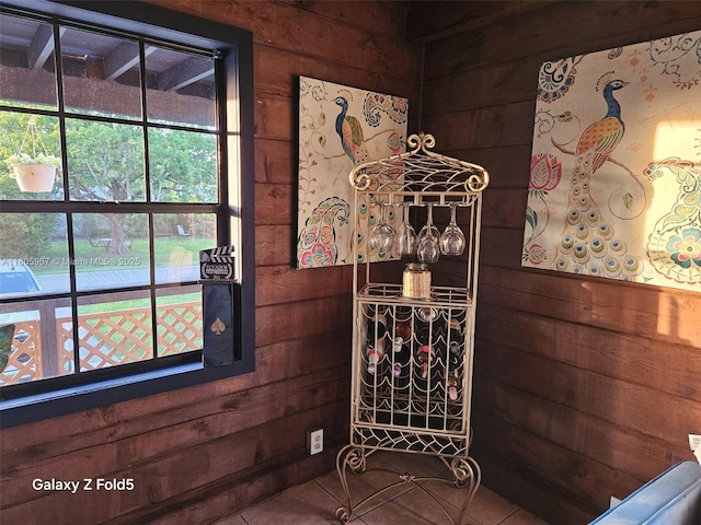 4070 E River Ft, Myers, FL 33916 - wine area with wooden walls, plenty of natural light, and tile patterned floors