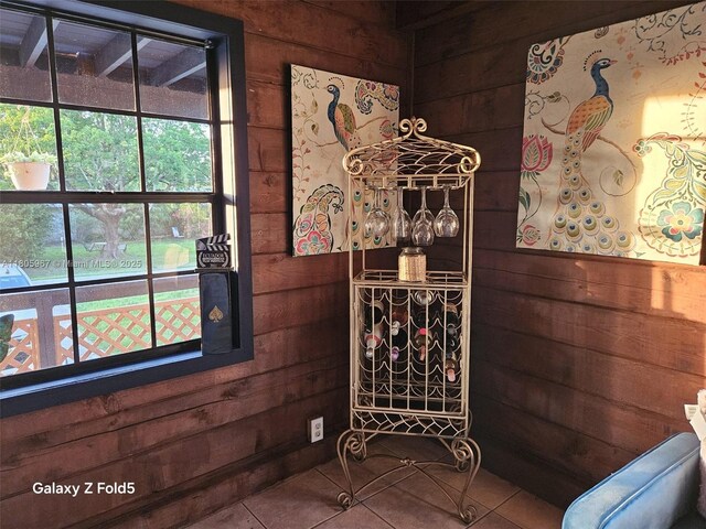 4070 E River Ft, Myers, FL 33916 - wine area featuring wood walls and tile patterned floors
