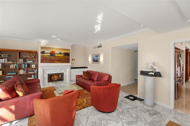 610 Valencia Ave Unit 503, Coral Gables, FL 33134 - living room featuring crown molding, light marble finish flooring, a fireplace, and baseboards