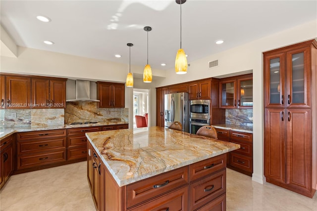 610 Valencia Ave Unit 503, Coral Gables, FL 33134 - kitchen with stainless steel appliances, wall chimney range hood, tasteful backsplash, recessed lighting, and a center island