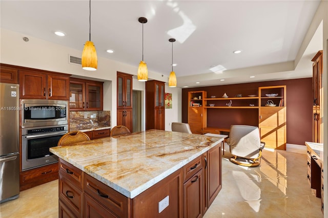 610 Valencia Ave Unit 503, Coral Gables, FL 33134 - kitchen featuring appliances with stainless steel finishes, pendant lighting, recessed lighting, decorative backsplash, and glass insert cabinets