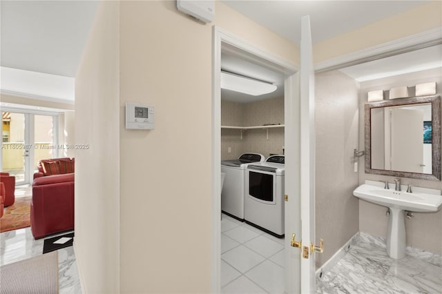 610 Valencia Ave Unit 503, Coral Gables, FL 33134 - bathroom with french doors, marble finish flooring, washer and dryer, and baseboards