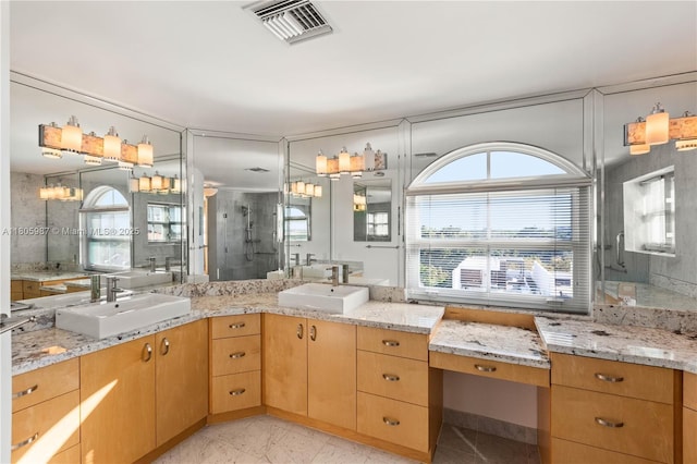 610 Valencia Ave Unit 503, Coral Gables, FL 33134 - bathroom featuring a sink, healthy amount of natural light, and a shower stall