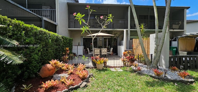 15545 SW 110th Ter, Miami, FL 33196 - rear view of house with stucco siding and a patio