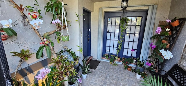 15545 SW 110th Ter, Miami, FL 33196 - view of exterior entry with stucco siding and french doors