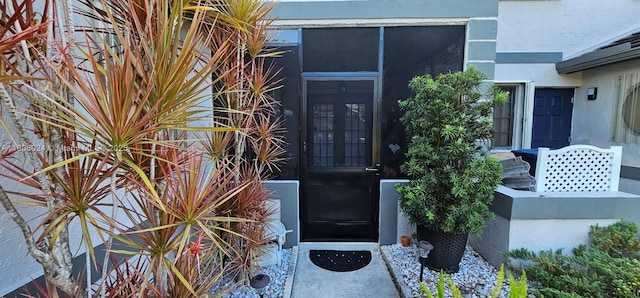 15545 SW 110th Ter, Miami, FL 33196 - doorway to property with stucco siding