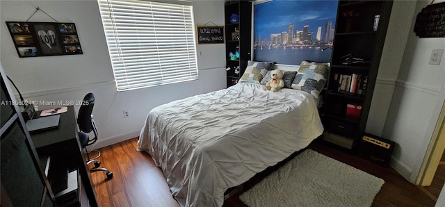15545 SW 110th Ter, Miami, FL 33196 - bedroom featuring wood finished floors and a desk