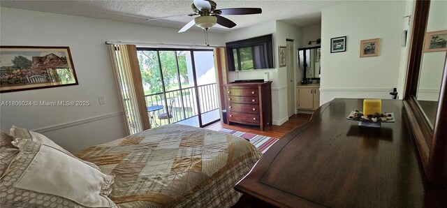 15545 SW 110th Ter, Miami, FL 33196 - bedroom with access to exterior, wood finished floors, a textured ceiling, and a ceiling fan