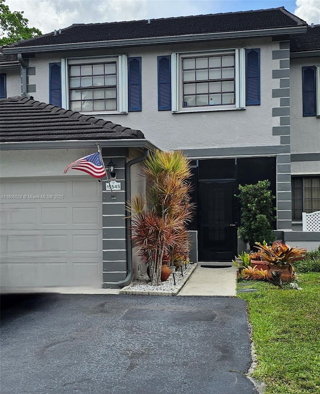 15545 SW 110th Ter, Miami, FL 33196 - view of front of property featuring stucco siding and a garage
