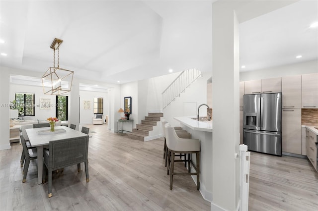 622 Malaga Ave Unit 622, Coral Gables, FL 33134 - dining area with light wood-style flooring, stairway, recessed lighting, a tray ceiling, and baseboards
