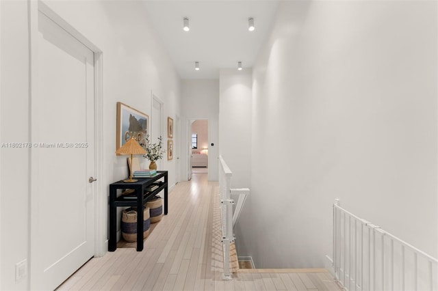 622 Malaga Ave Unit 622, Coral Gables, FL 33134 - hall featuring light wood finished floors and an upstairs landing