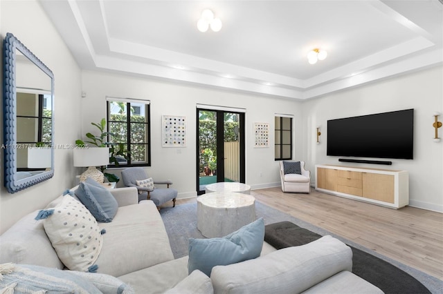 622 Malaga Ave Unit 622, Coral Gables, FL 33134 - living room with a tray ceiling, wood finished floors, and baseboards
