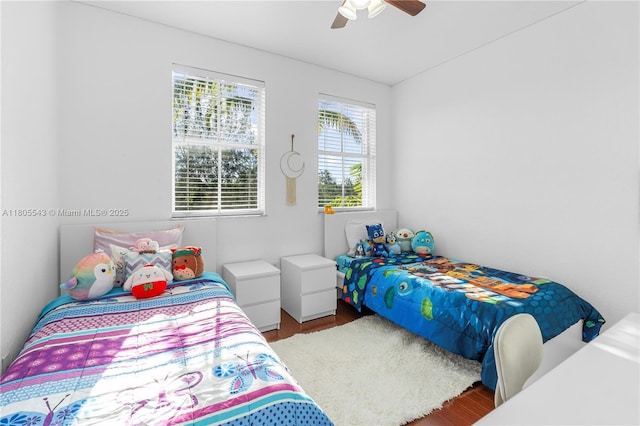 bedroom with wood finished floors and ceiling fan
