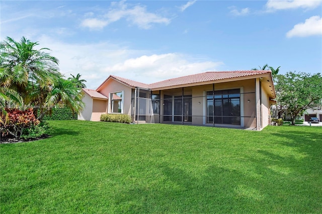 2701 Edgewater Ct, Weston, FL 33332 - rear view of property with stucco siding, a tile roof, and a lawn