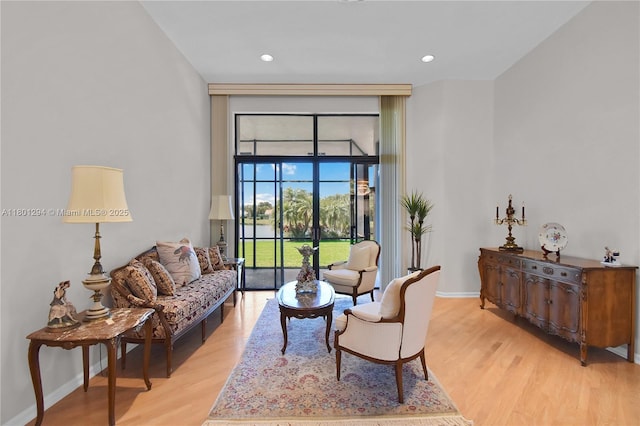 2701 Edgewater Ct, Weston, FL 33332 - living room with light wood-style floors, baseboards, floor to ceiling windows, and recessed lighting