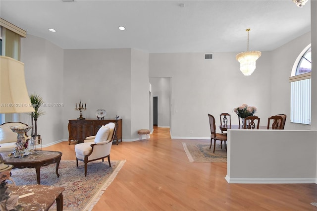 2701 Edgewater Ct, Weston, FL 33332 - living room featuring light wood-style flooring, baseboards, recessed lighting, and a chandelier