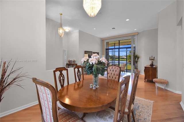 2701 Edgewater Ct, Weston, FL 33332 - dining area featuring light wood finished floors, baseboards, a chandelier, and recessed lighting