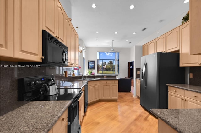 2701 Edgewater Ct, Weston, FL 33332 - kitchen with black appliances, light brown cabinetry, light wood-style floors, recessed lighting, and tasteful backsplash