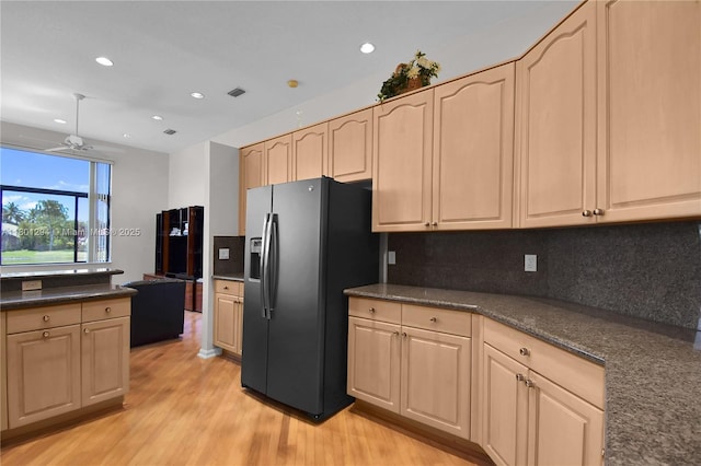 2701 Edgewater Ct, Weston, FL 33332 - kitchen with black refrigerator with ice dispenser, light brown cabinets, decorative backsplash, light wood-style flooring, and recessed lighting