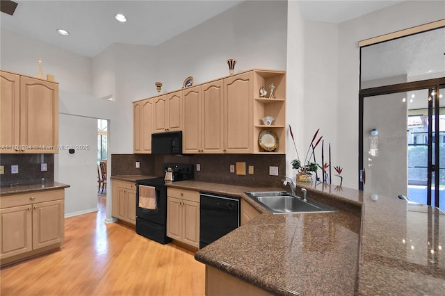 2701 Edgewater Ct, Weston, FL 33332 - kitchen with a sink, black appliances, light brown cabinets, light wood-style floors, and recessed lighting