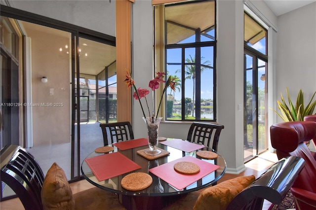 2701 Edgewater Ct, Weston, FL 33332 - dining area with healthy amount of natural light and wood finished floors