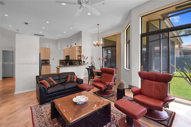 2701 Edgewater Ct, Weston, FL 33332 - living room featuring light wood-style floors, a chandelier, a ceiling fan, recessed lighting, and baseboards