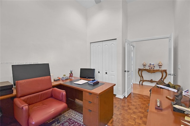 2701 Edgewater Ct, Weston, FL 33332 - home office with a towering ceiling and baseboards
